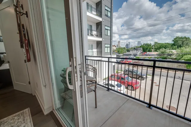 a view of a balcony with chairs