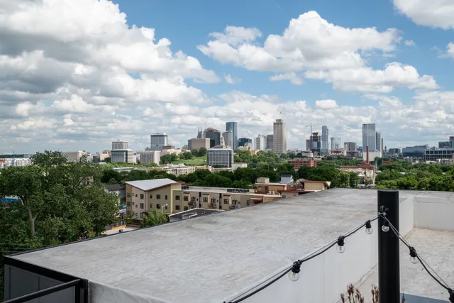a view of a patio with dining table and chairs