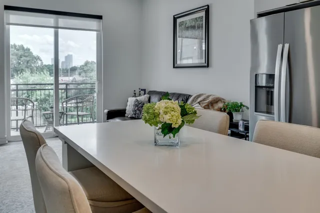 a dining room with furniture and window