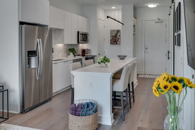 a kitchen with refrigerator and window