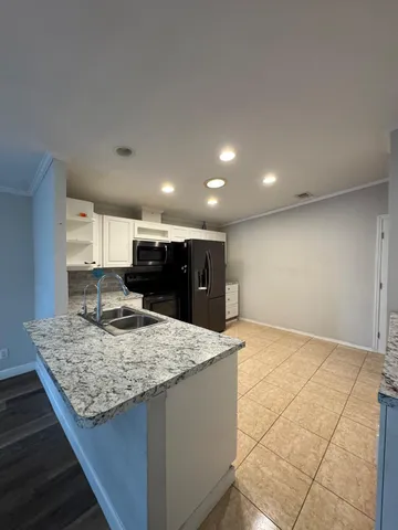 a view of kitchen island kitchen island sink and living room