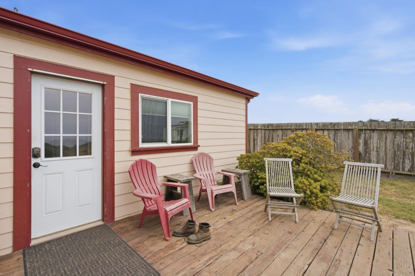 1263 Reservoir Road Pescadero, CA 94060 - Photo 46 of 66 a view of a deck with table and chairs and wooden floor