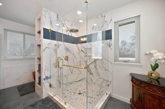 a view of a house with backyard sitting area and garden