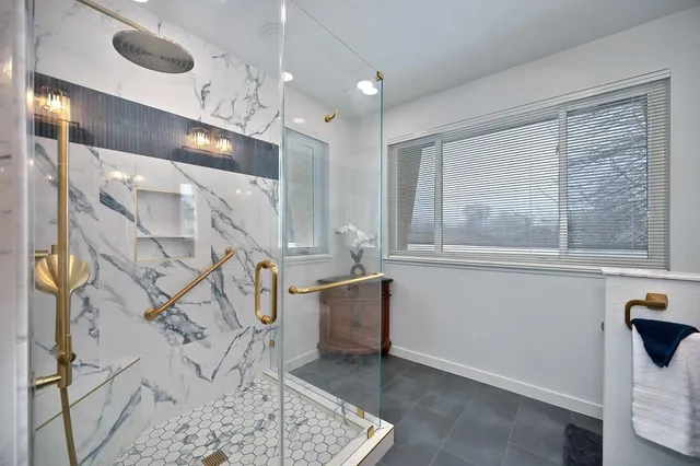 a view of a house with pool and sitting area