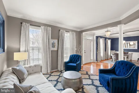 a living room with furniture window and a fireplace