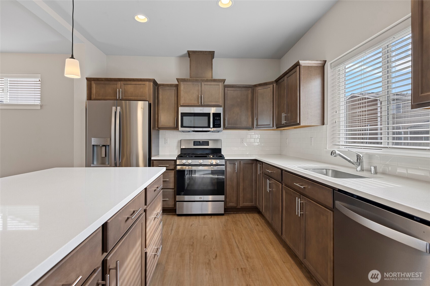 122 North Trl Road Sedro-Woolley, WA 98284 - Photo 13 of 40 a kitchen with stainless steel appliances a sink cabinets and wooden floor