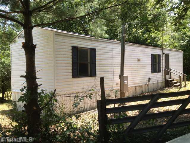 314 North River Ridge Road Jonesville, NC 28642 - Photo 12 of 12 Other. Single-wide MH on property which could be repaired for rental income or used for storage.