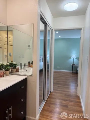 a view of a bathroom from a hallway