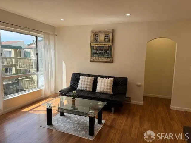 a living room with furniture and a window