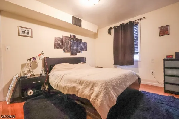 a bedroom with a bed and a mirror