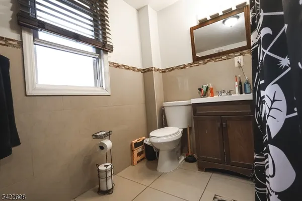 a bathroom with a mirror and a shower