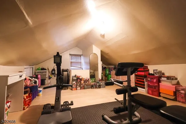 a view of a gym equipment and a group of people