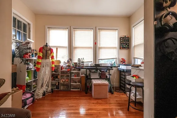 a very nice looking room with many windows and furniture