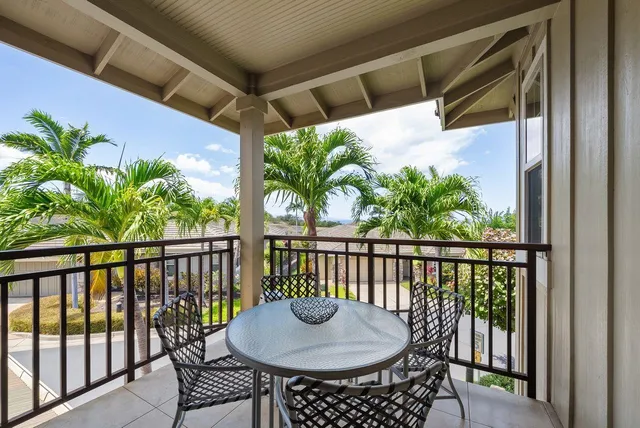 a bathroom with a tub a sink and a window