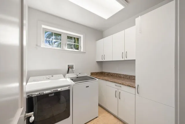 a bathroom with a sink mirror and toilet