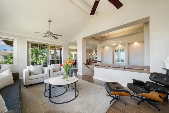 a view of a balcony with dining table and chairs