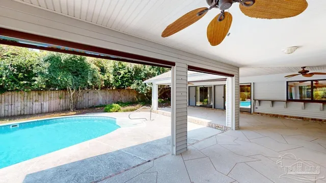 a view of a house with backyard and porch