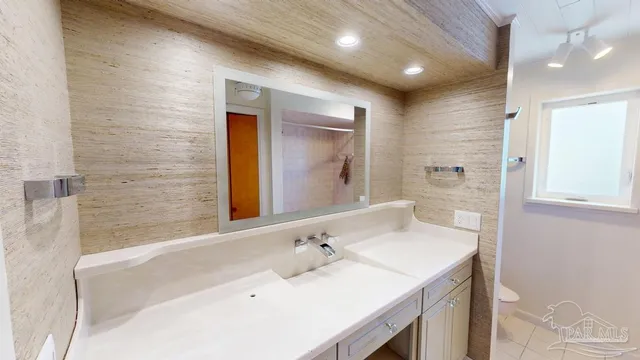 a bathroom with a sink and a mirror