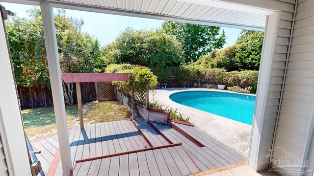 a view of a two chairs in the balcony