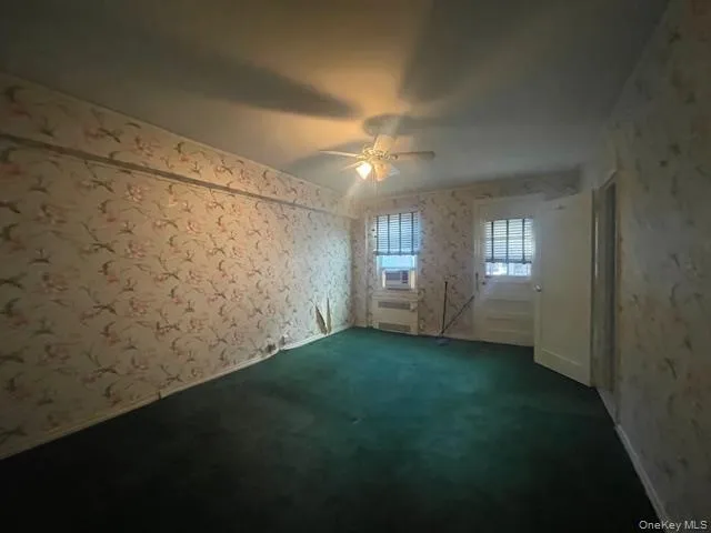 a view of an empty room and window