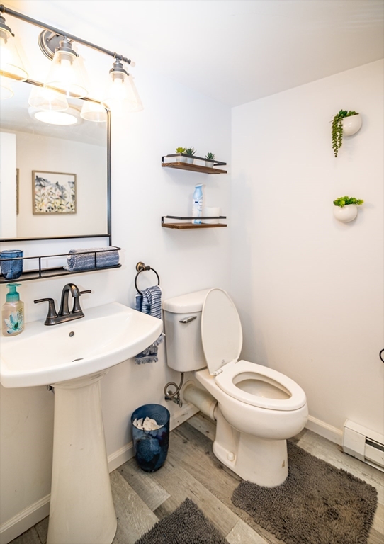 220 West Main Street Dudley, MA 01571 - Photo 31 of 42 a bathroom with a sink toilet and a mirror