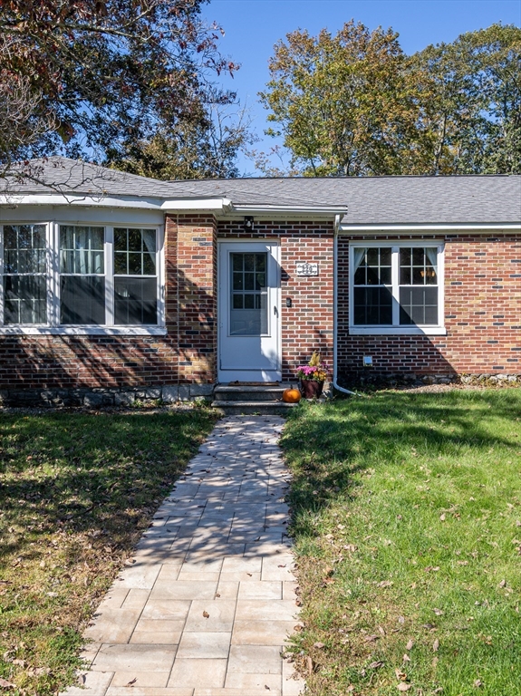 220 West Main Street Dudley, MA 01571 - Photo 40 of 42 a front view of a house with garden
