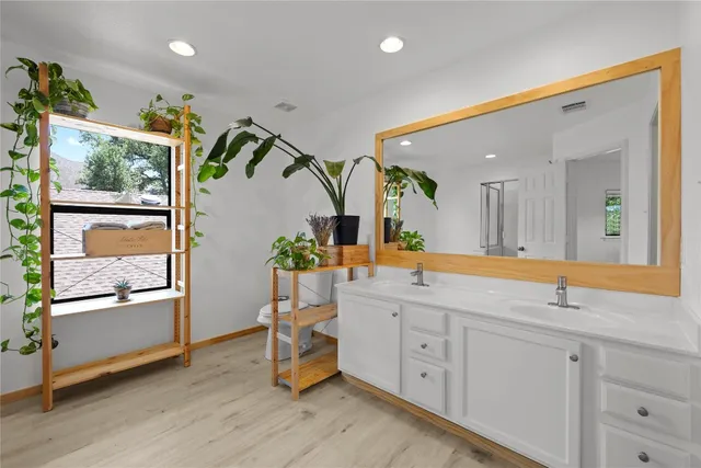 a view of a bathroom with sink and mirror