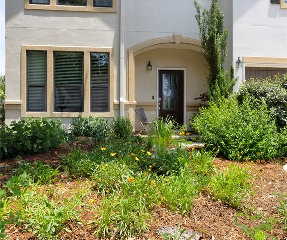 front view of a house with potted plants