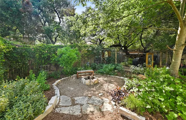 a view of backyard with seating area and green space
