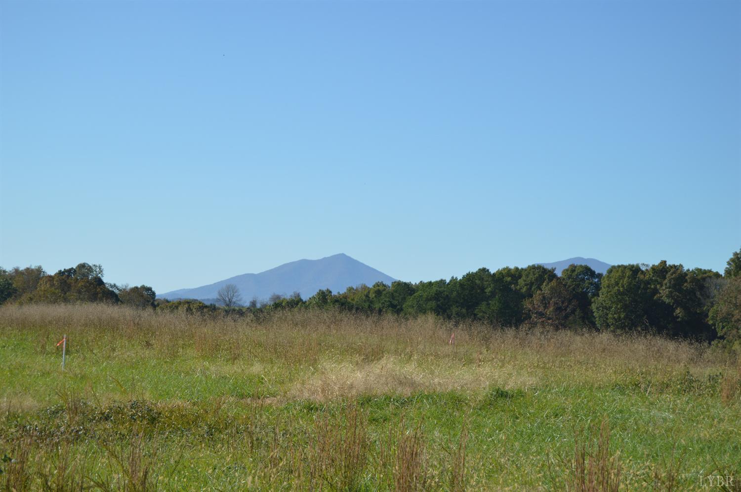 a view of lake with mountain in background