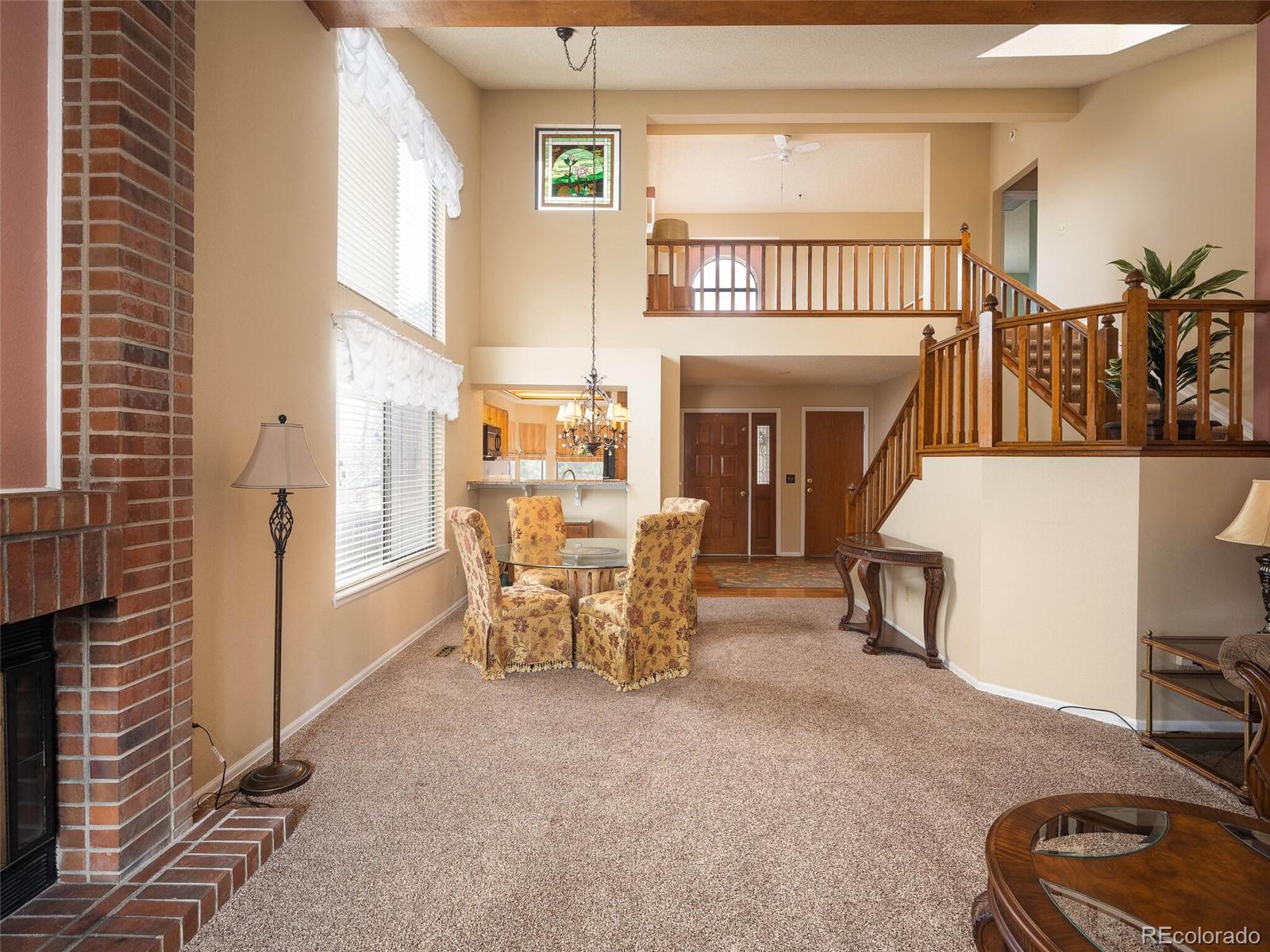 8634 Redstone Street Highlands Ranch, CO 80126 - Photo 11 of 25 a view of a livingroom with furniture and a fireplace