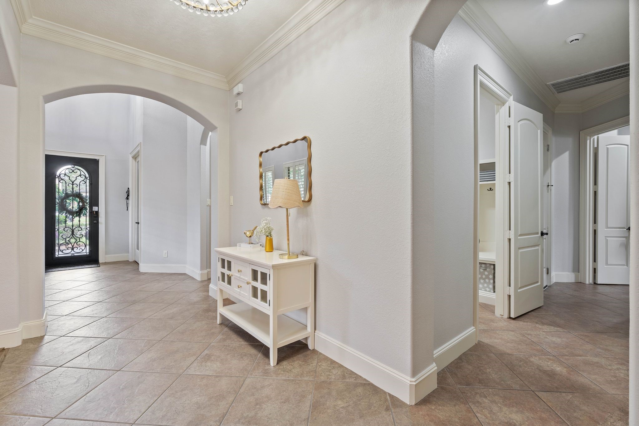 7603 Hogan Bridge Court Spring, TX 77389 - Photo 12 of 49 The foyer leading to the laundry room, garage, and primary suite.