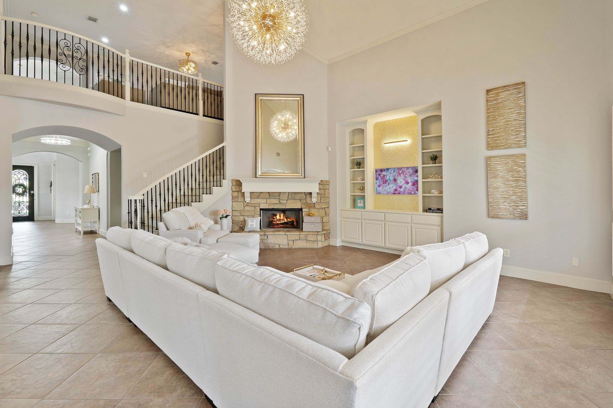 7603 Hogan Bridge Court Spring, TX 77389 - Photo 15 of 49 a living room with furniture and a chandelier