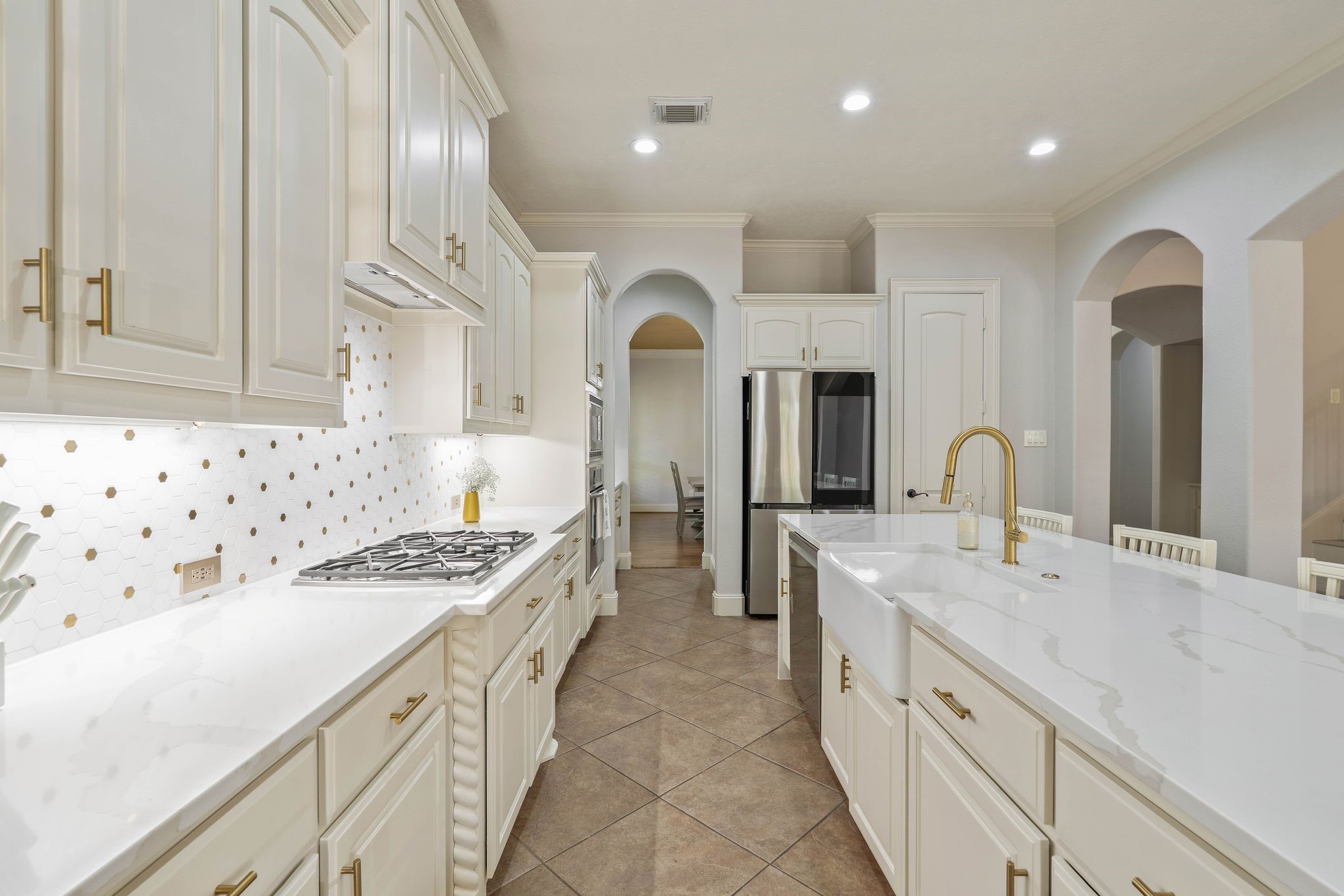 7603 Hogan Bridge Court Spring, TX 77389 - Photo 20 of 49 a large kitchen with stainless steel appliances granite countertop a stove and a sink