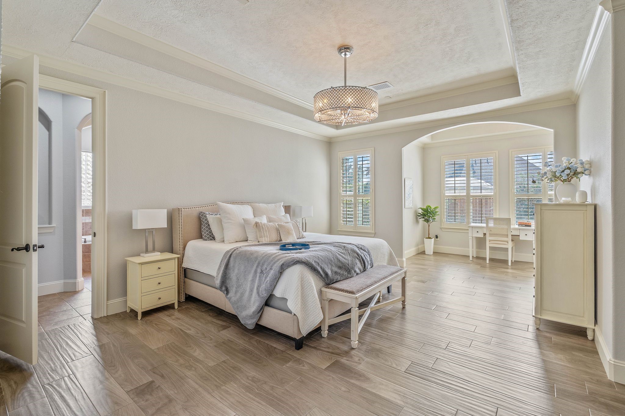 7603 Hogan Bridge Court Spring, TX 77389 - Photo 22 of 49 a spacious bedroom with a bed and chandelier