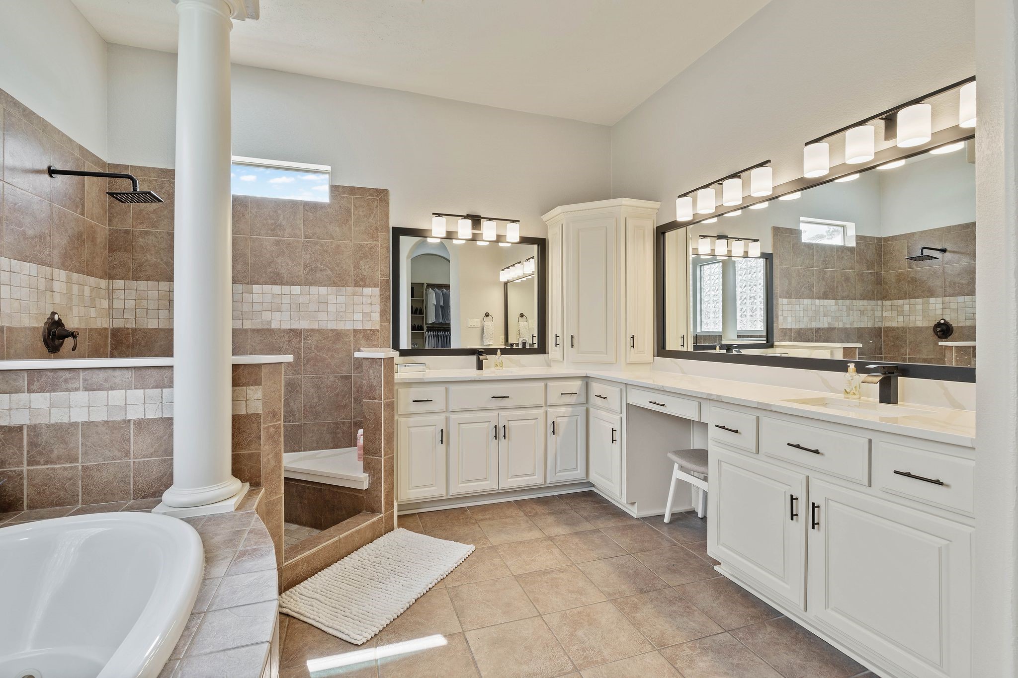7603 Hogan Bridge Court Spring, TX 77389 - Photo 27 of 49 a spacious bathroom with a granite countertop sink mirror and bathtub