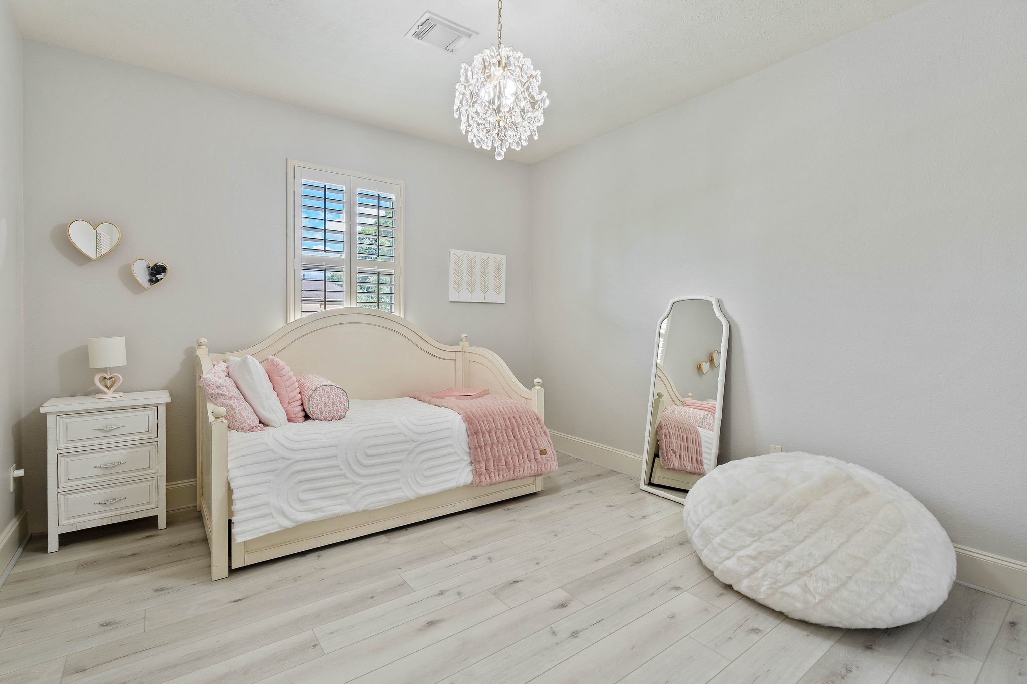 7603 Hogan Bridge Court Spring, TX 77389 - Photo 32 of 49 a bedroom with a bed and a chandelier