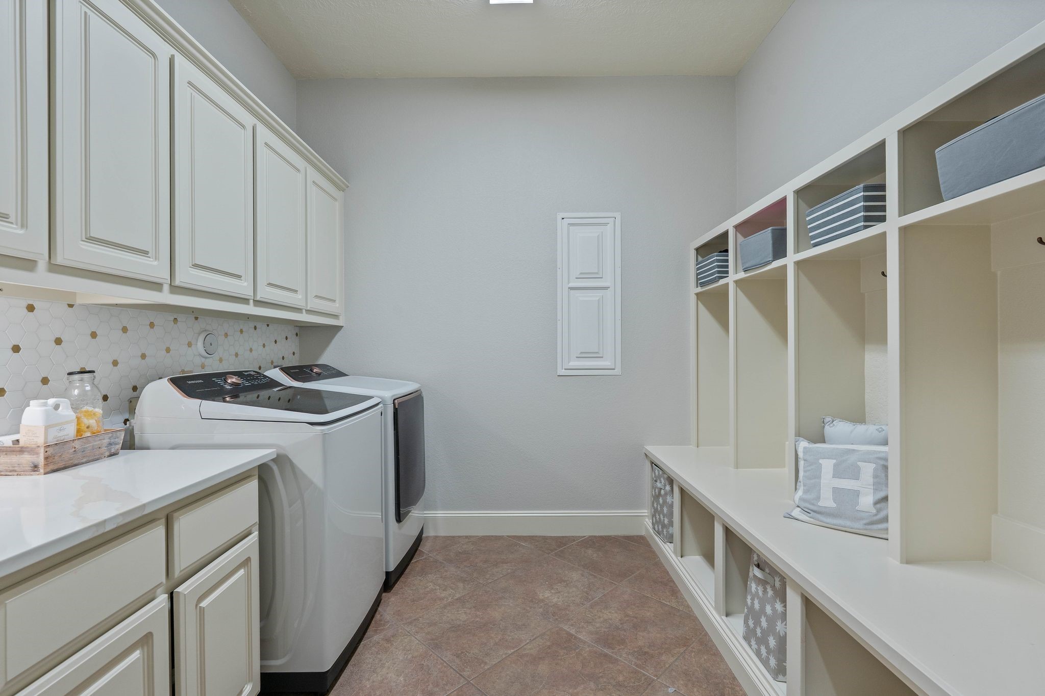 7603 Hogan Bridge Court Spring, TX 77389 - Photo 37 of 49 a utility room with cabinets washer and dryer