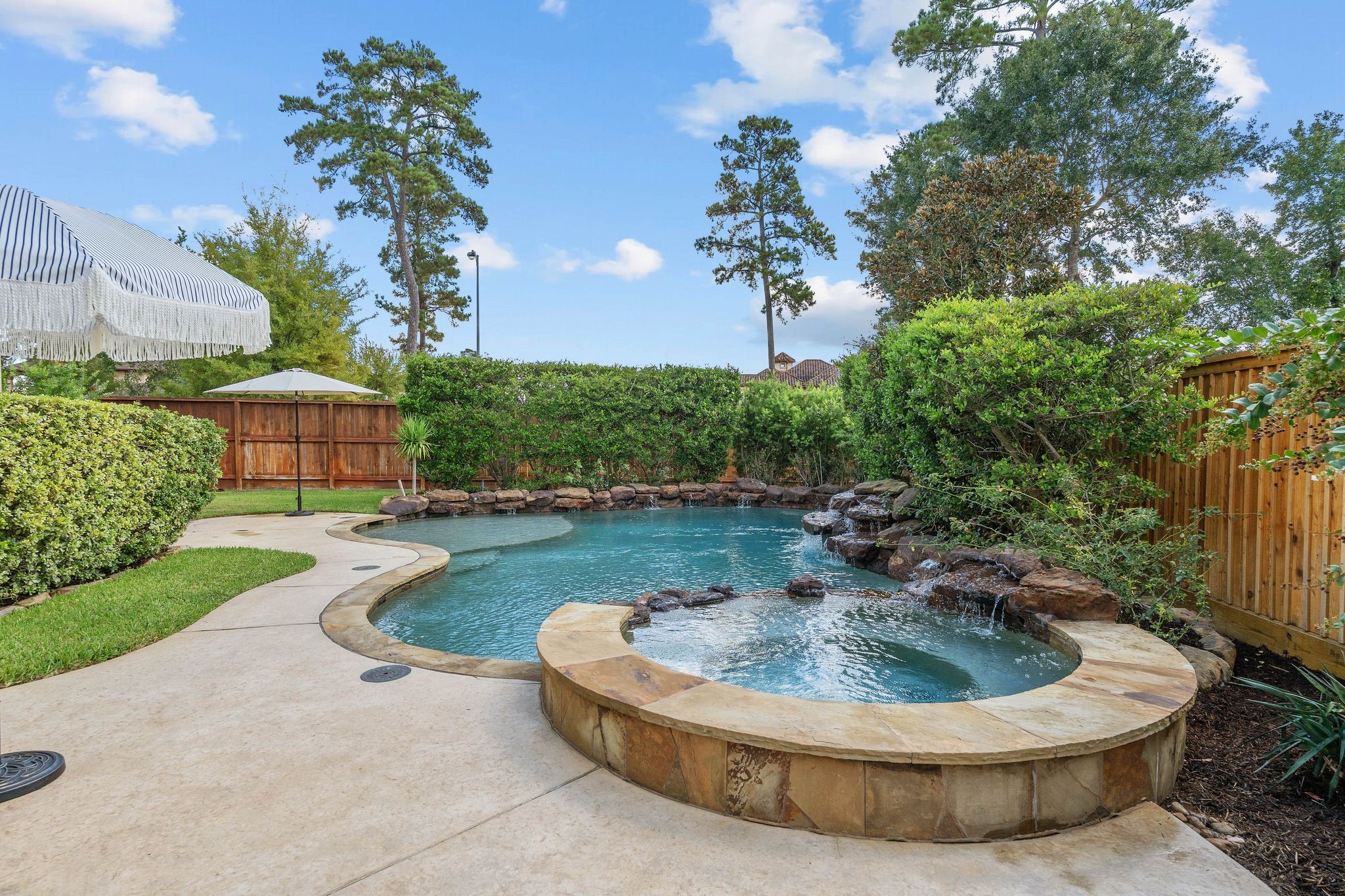 7603 Hogan Bridge Court Spring, TX 77389 - Photo 41 of 49 a view of a house with swimming pool and a yard