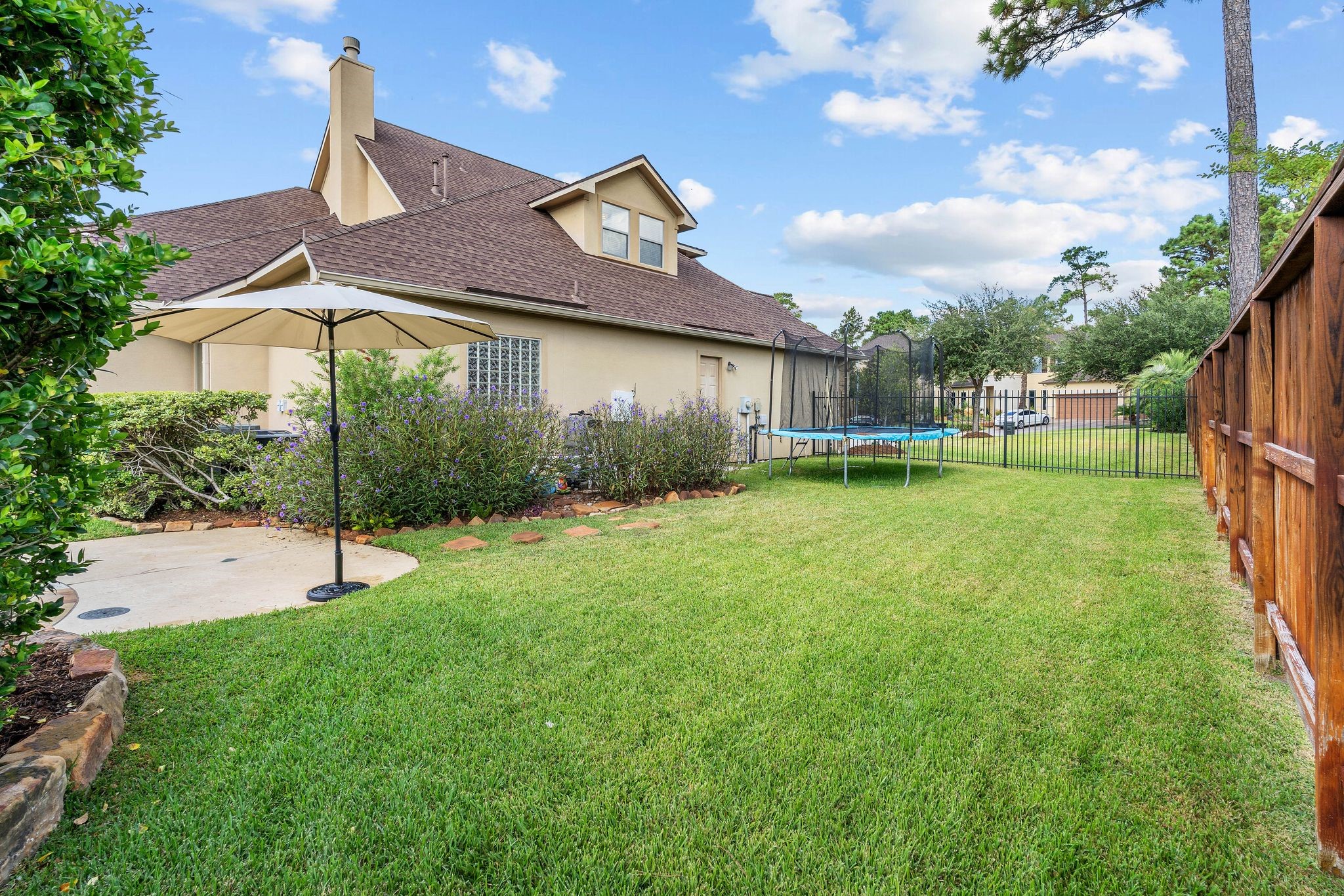 7603 Hogan Bridge Court Spring, TX 77389 - Photo 44 of 49 a backyard of a house with table and chairs