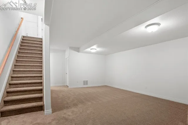 an empty room with wooden floor