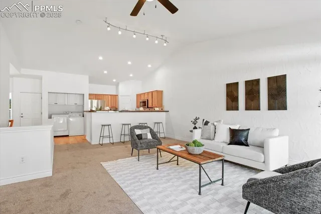 a living room with furniture and a rug
