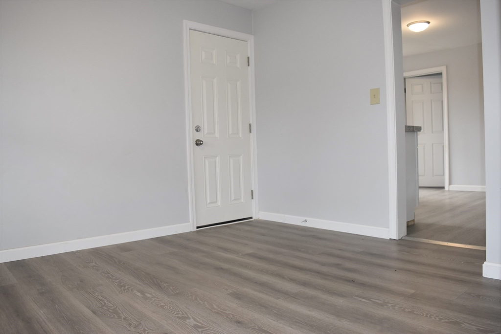 7 Pearl Street Southbridge, MA 01550 - Photo 11 of 41 a view of an empty room with wooden floor