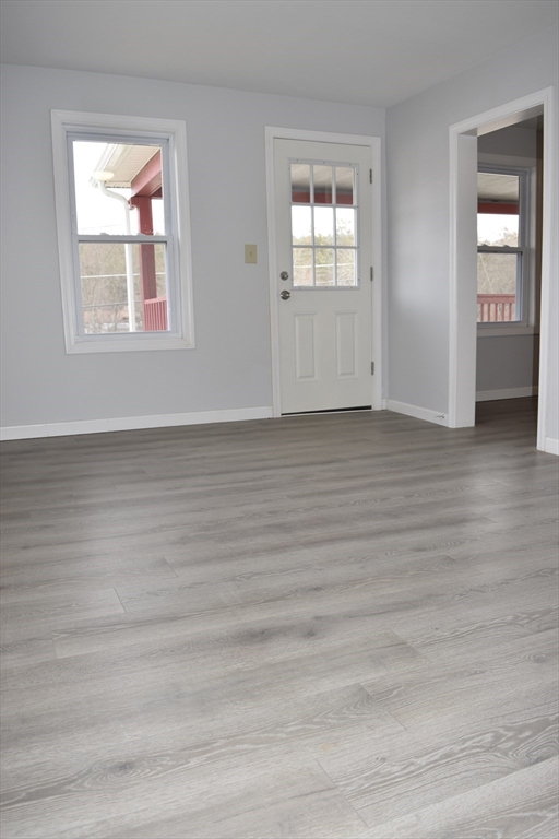 7 Pearl Street Southbridge, MA 01550 - Photo 14 of 41 a view of an empty room with wooden floor and a window