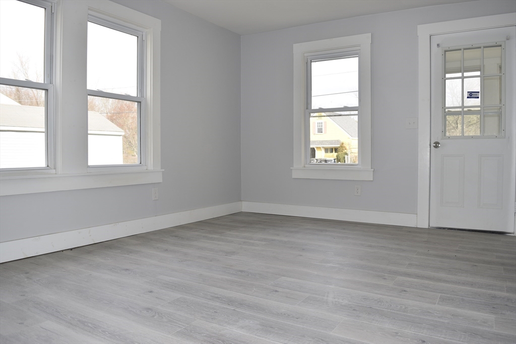 7 Pearl Street Southbridge, MA 01550 - Photo 18 of 41 an empty room with wooden floor and windows