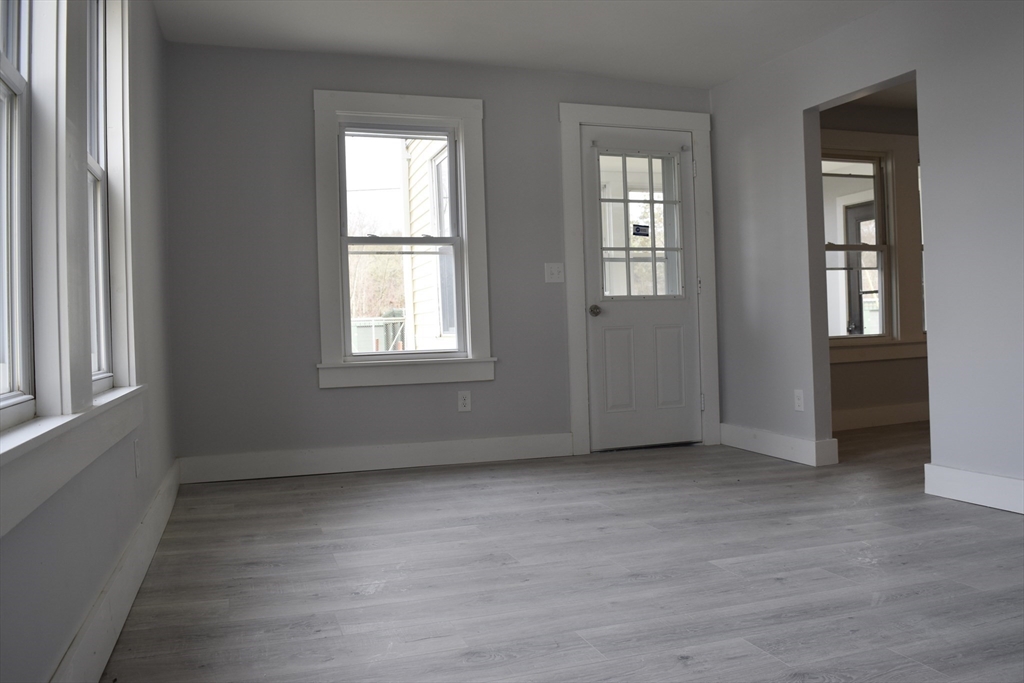 7 Pearl Street Southbridge, MA 01550 - Photo 21 of 41 an empty room with wooden floor and windows