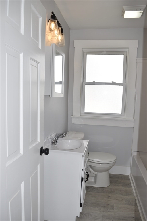 7 Pearl Street Southbridge, MA 01550 - Photo 25 of 41 a bathroom with a toilet sink and mirror
