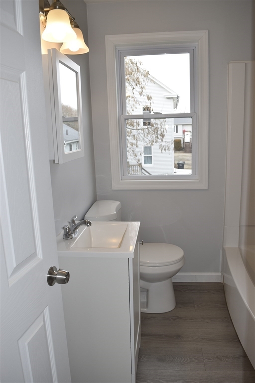 7 Pearl Street Southbridge, MA 01550 - Photo 8 of 41 a bathroom with a toilet sink and mirror