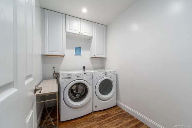 a utility room with sink dryer and washer