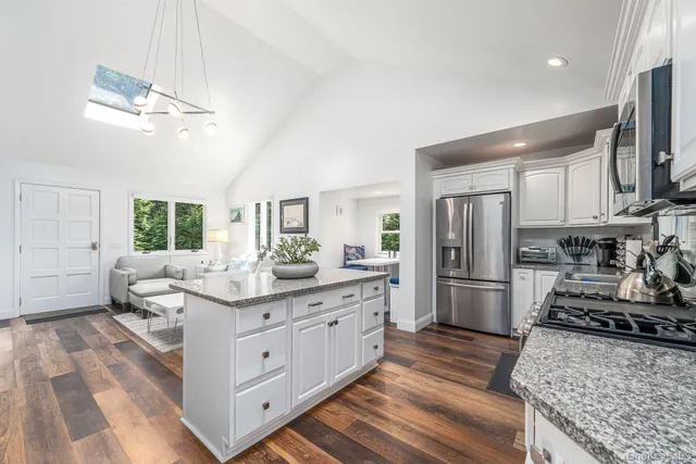 a kitchen with a sink stove and refrigerator